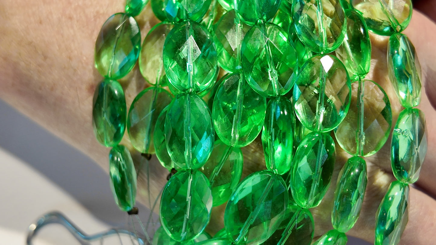 Green Quartz faceted flat oval beads. Approx 14x16 8" strand, probably treated