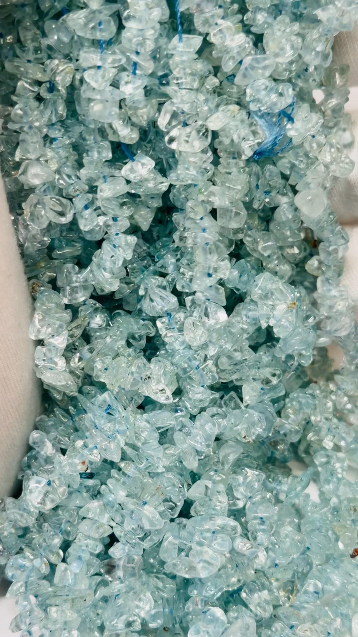 Strands of aquamarine tumble chips
