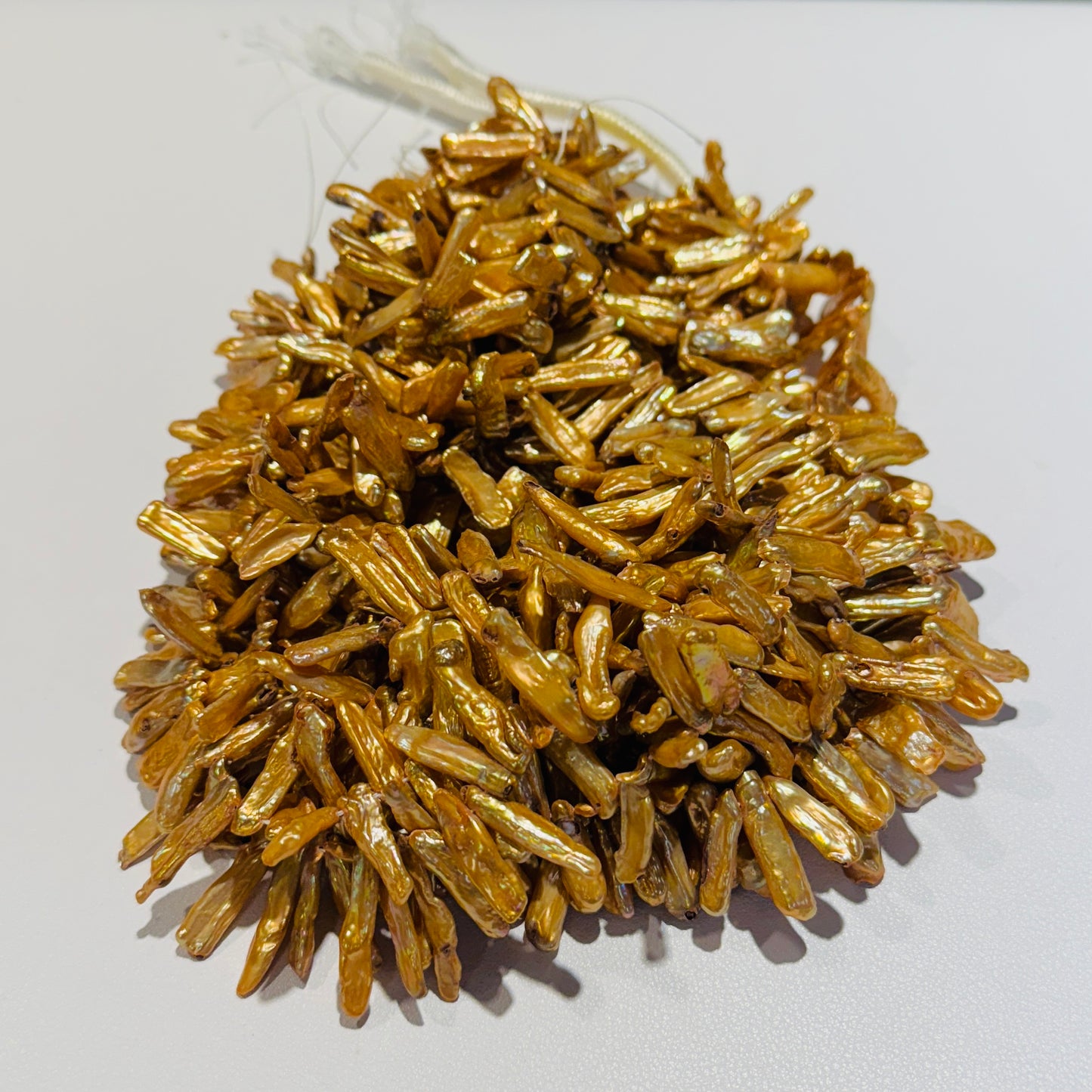 Golden Stick Pearls 5x20 slight graduation 16" strands