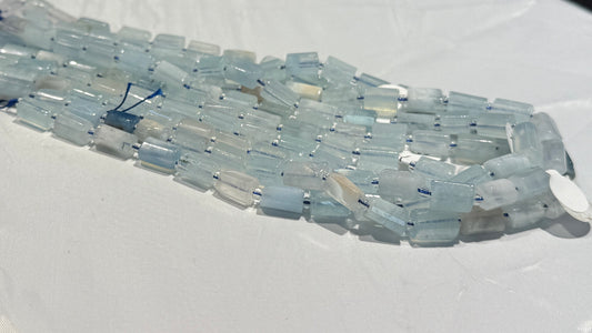 Genuine Aquamarine, Rod shaped with flat sides. Approx. 7x11 16" strands