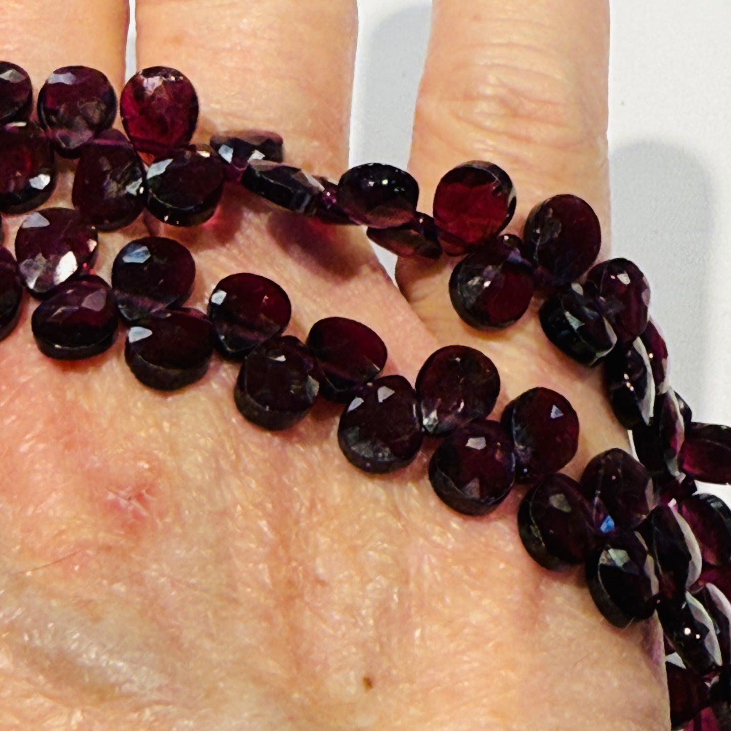 Rhodolite Garnet briolettes Faceted, purple hue approx 10" strands