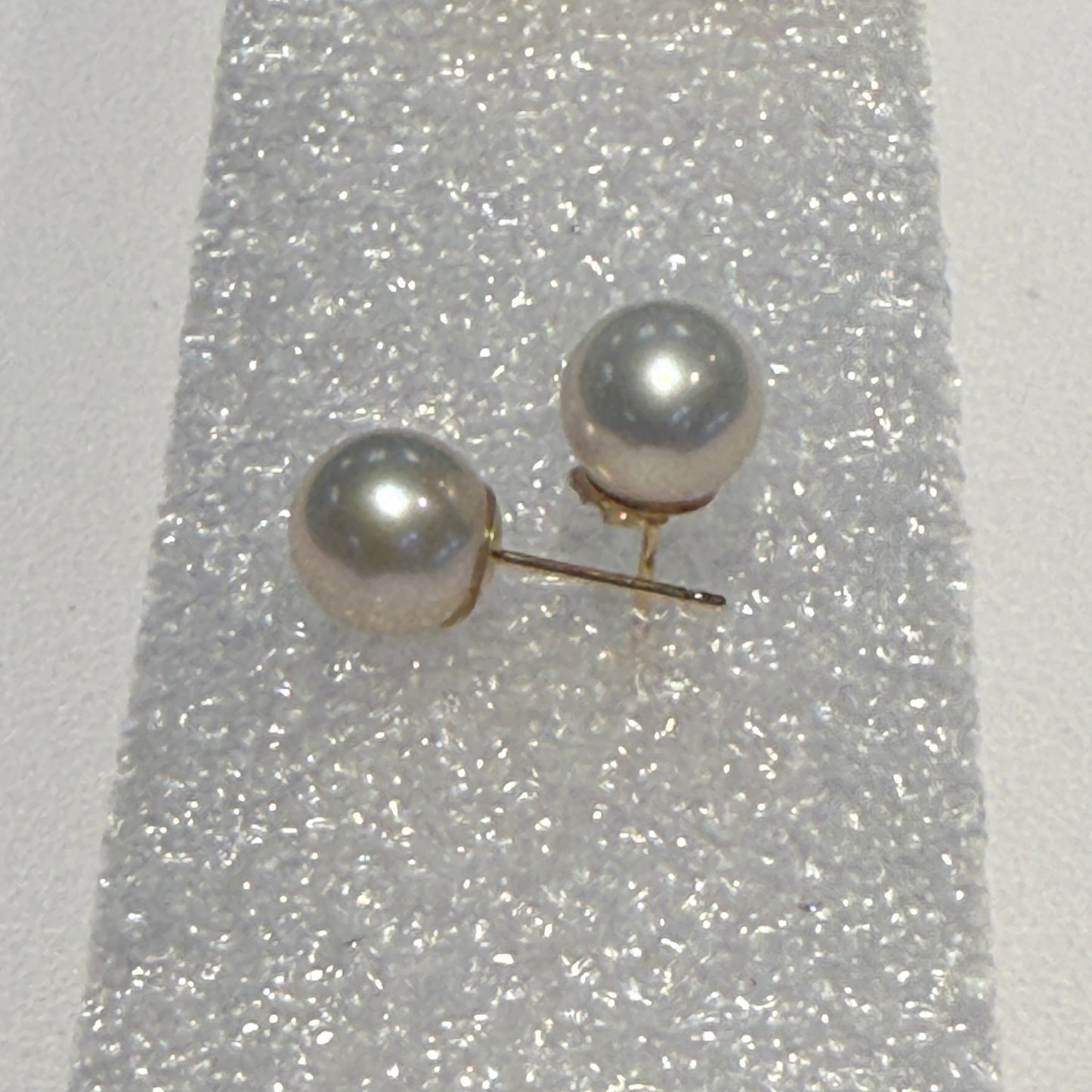 Round 8 mm Pearl studs set in 14kt gold. Ear backs not included
