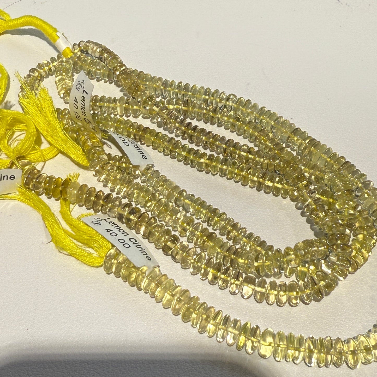 Lemon Citrine 8 mm disc shaped. Strands are about 10", no treatments