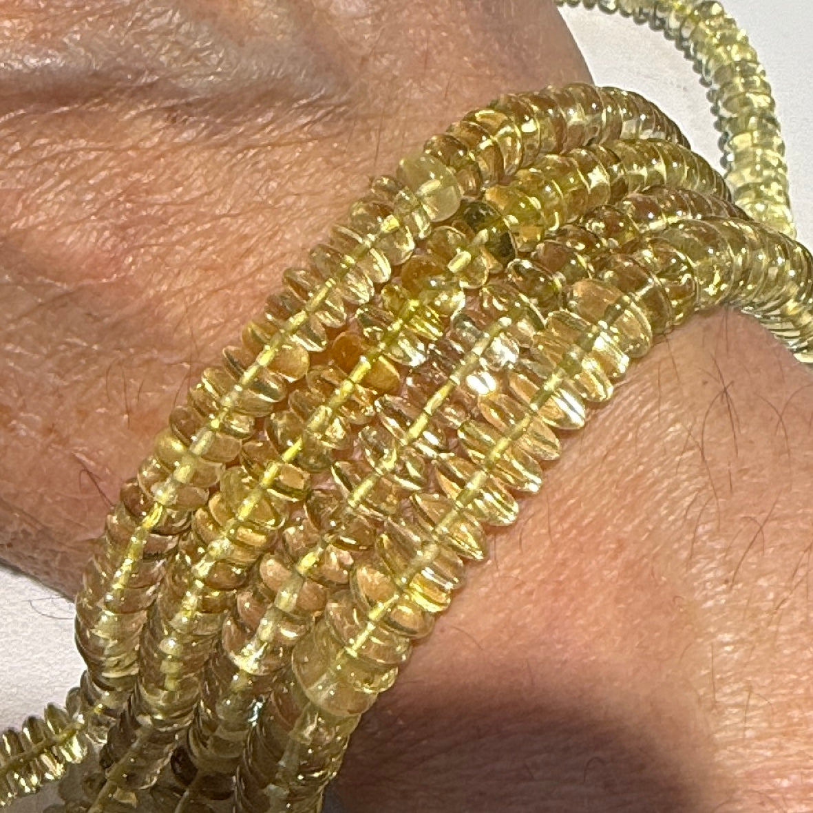 Lemon Citrine 8 mm disc shaped. Strands are about 10", no treatments