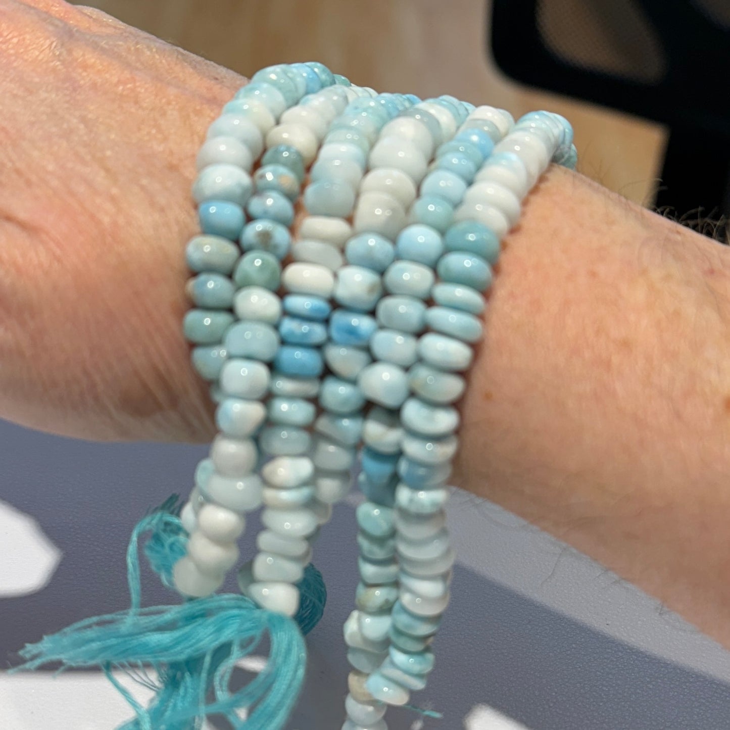 Larimar Roundels Hand cut and polished. approx 7 mm 15" strands