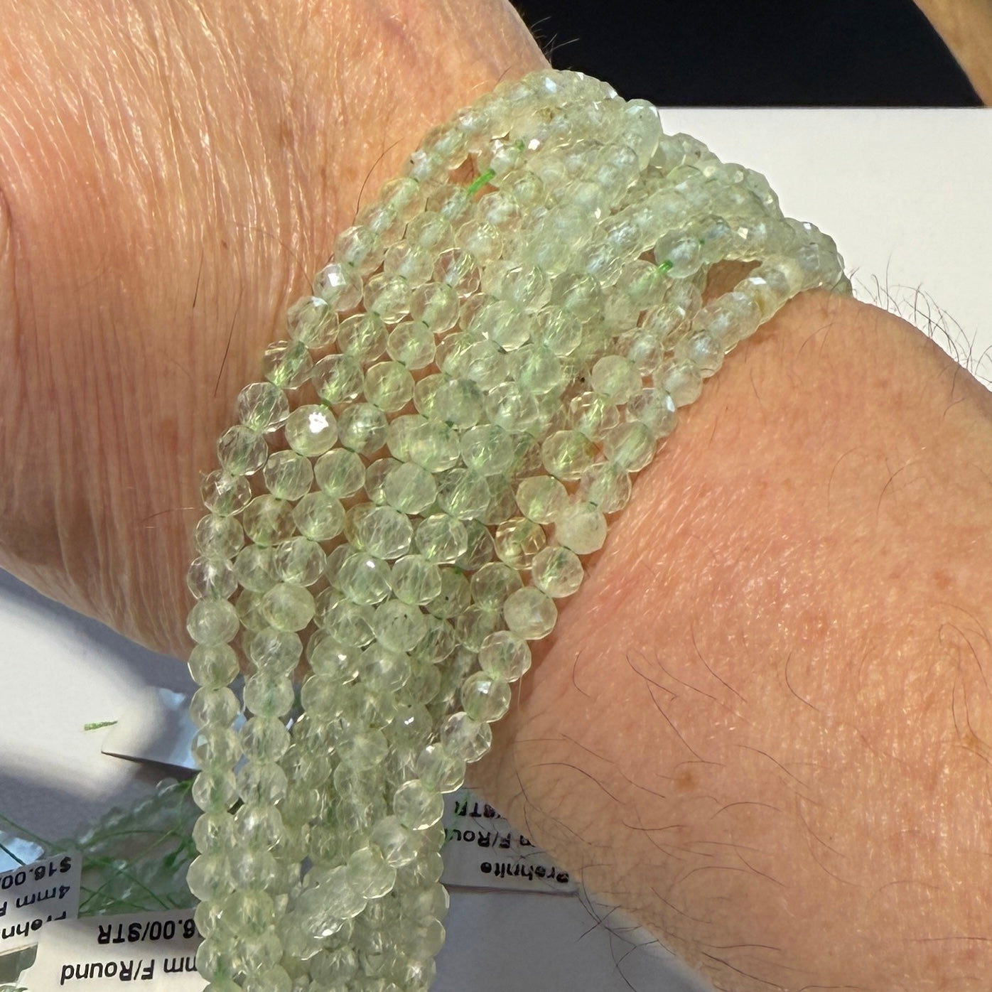 Prehnite 4 mm faceted round beads. Approx 15" strands