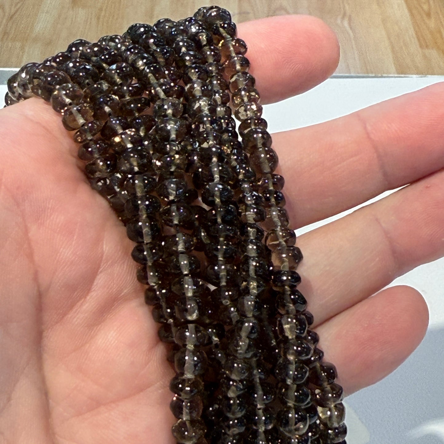 Smokey Quartz roundels smooth. Approx 6 mm 15" strands, natural