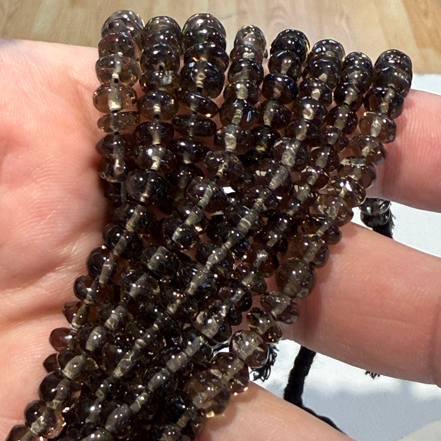 Smokey Quartz roundels smooth. Approx 6 mm 15" strands, natural