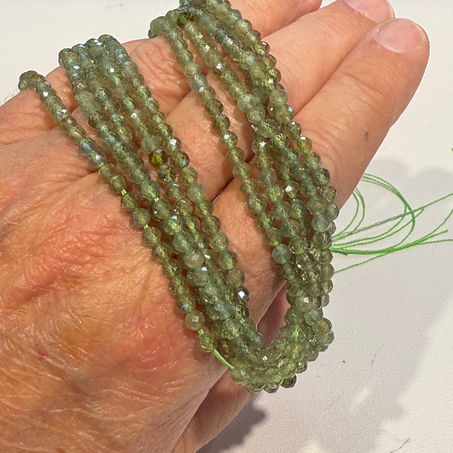 Peridot 4 mm faceted round beads 15" strands