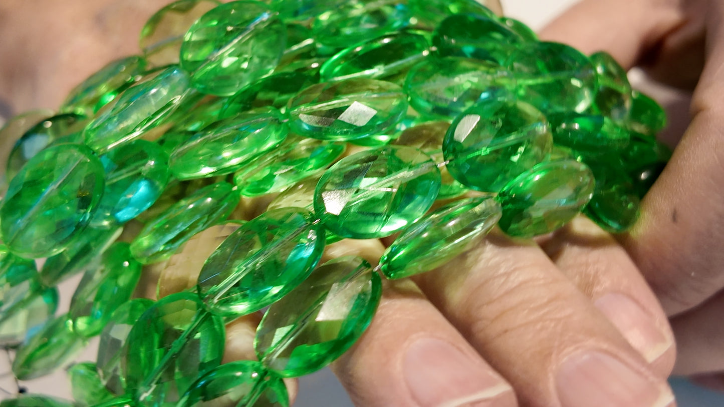 Green Quartz faceted flat oval beads.  Approx 14x16  8" strand, probably treated