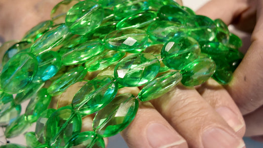 Green Quartz faceted flat oval beads.  Approx 14x16  8" strand, probably treated