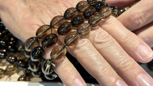 Smokey Quartz Olive shape, all natural.  Smooth polish, approx 10x14 15" strands!
