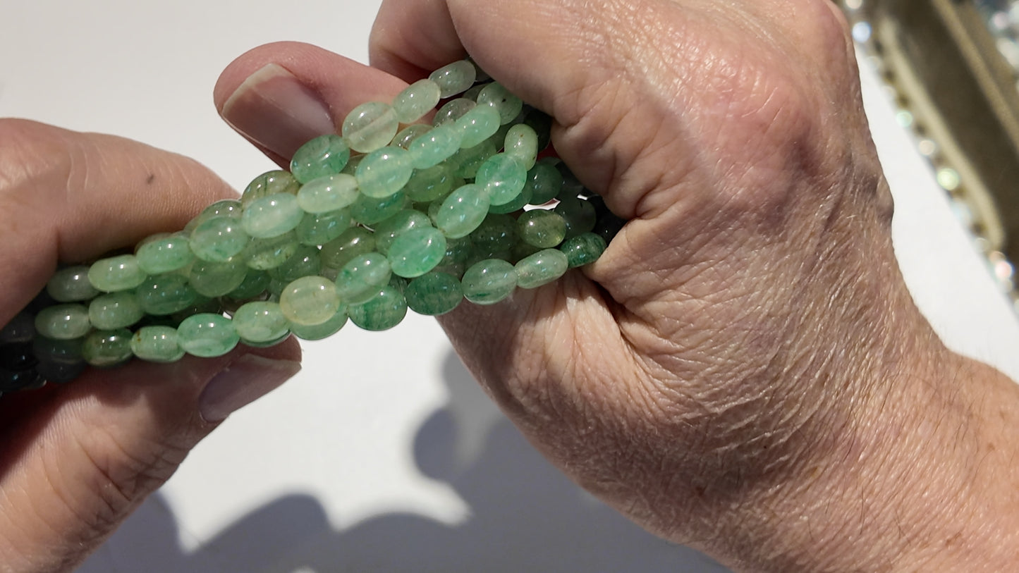 Natural gemstones 6x8mm approx 16" strands flat olive shape.  $10 a strand!