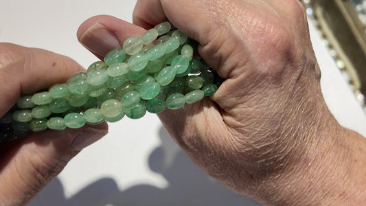 Natural gemstones 6x8mm approx 16" strands flat olive shape.  $10 a strand!