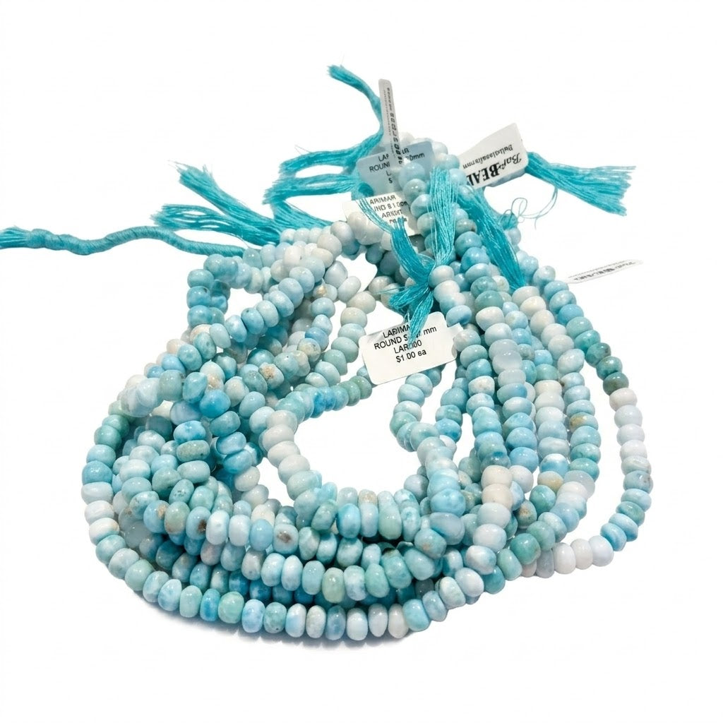 Natural Larimar Roundels, approx 7mm, 14" stands.Really good examples of Larimar! $49 a strand