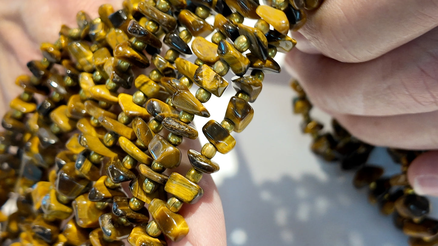 Tiger Eye with metal beads. Polished nuggets 24" strands graduated $10 a strand
