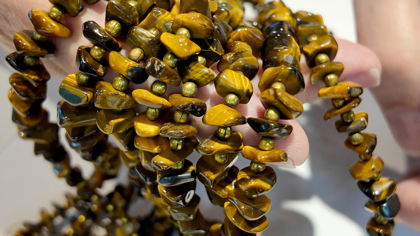 Tiger Eye with metal beads. Polished nuggets 24" strands graduated $10 a strand