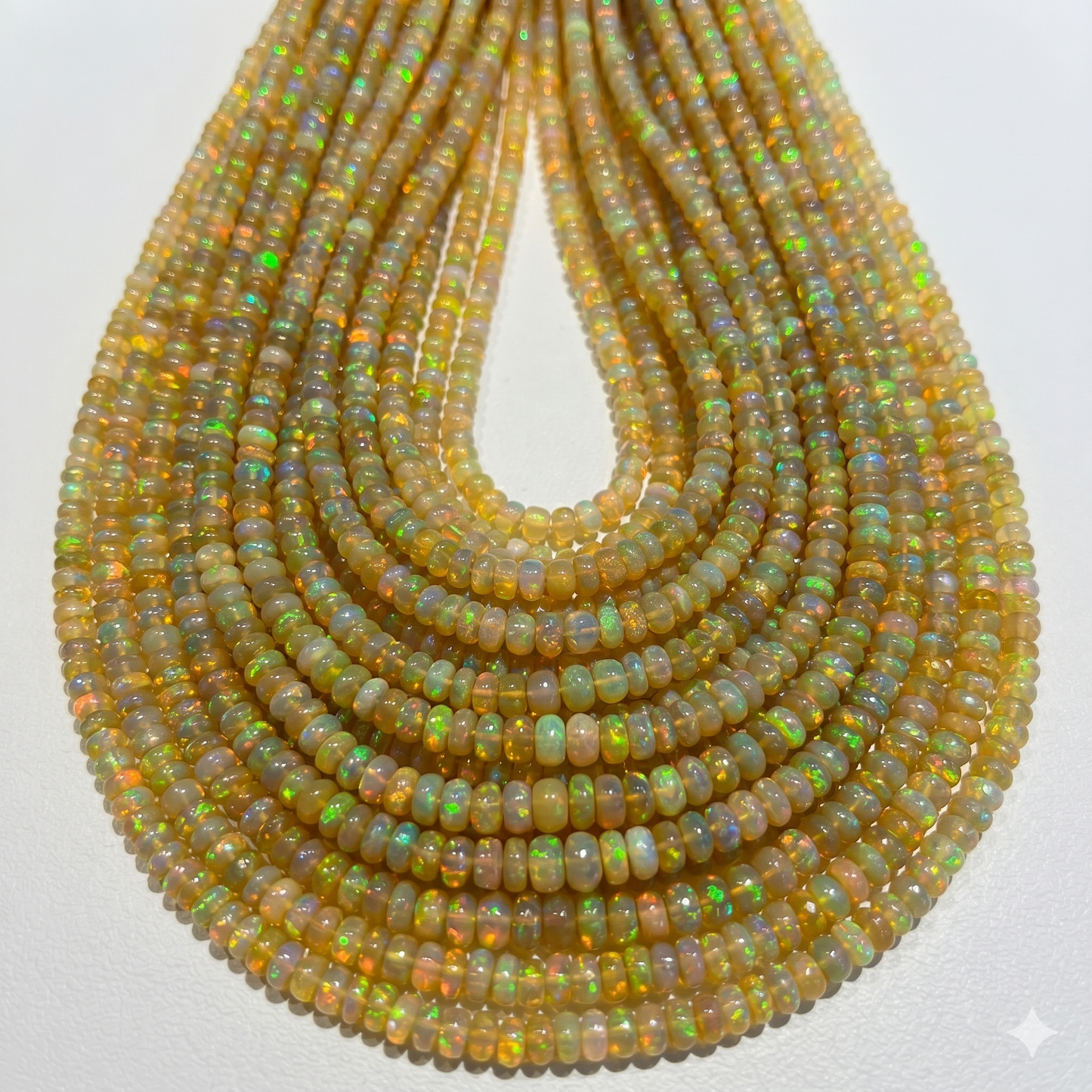 Golden Base Ethiopian Opal Beads.  3-4mm approx 15" strands.  Lots of color and fire!