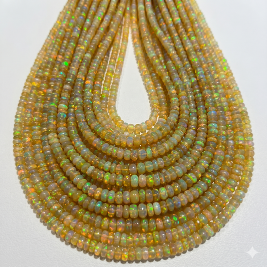 Golden Base Ethiopian Opal Beads.  3-4mm approx 15" strands.  Lots of color and fire!