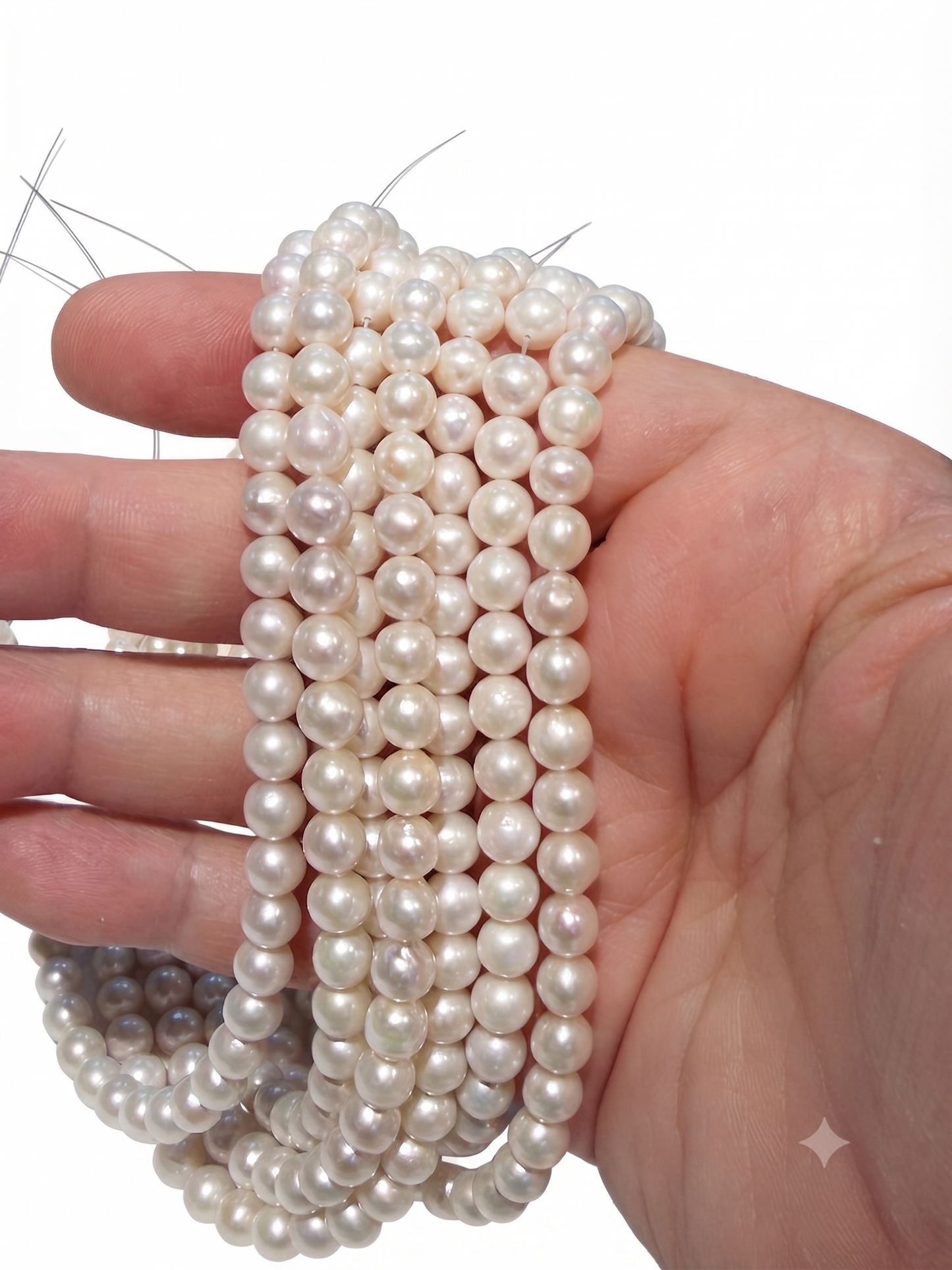 Genuine Pearls approx 6mm, 15" strands.  Near Round, lots of luster!
