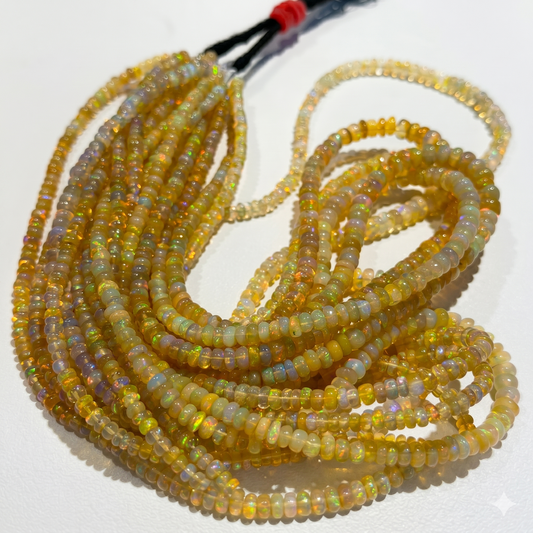 Golden Base Ethiopian Opal Beads.  3-4mm approx 15" strands.  Lots of color and fire!