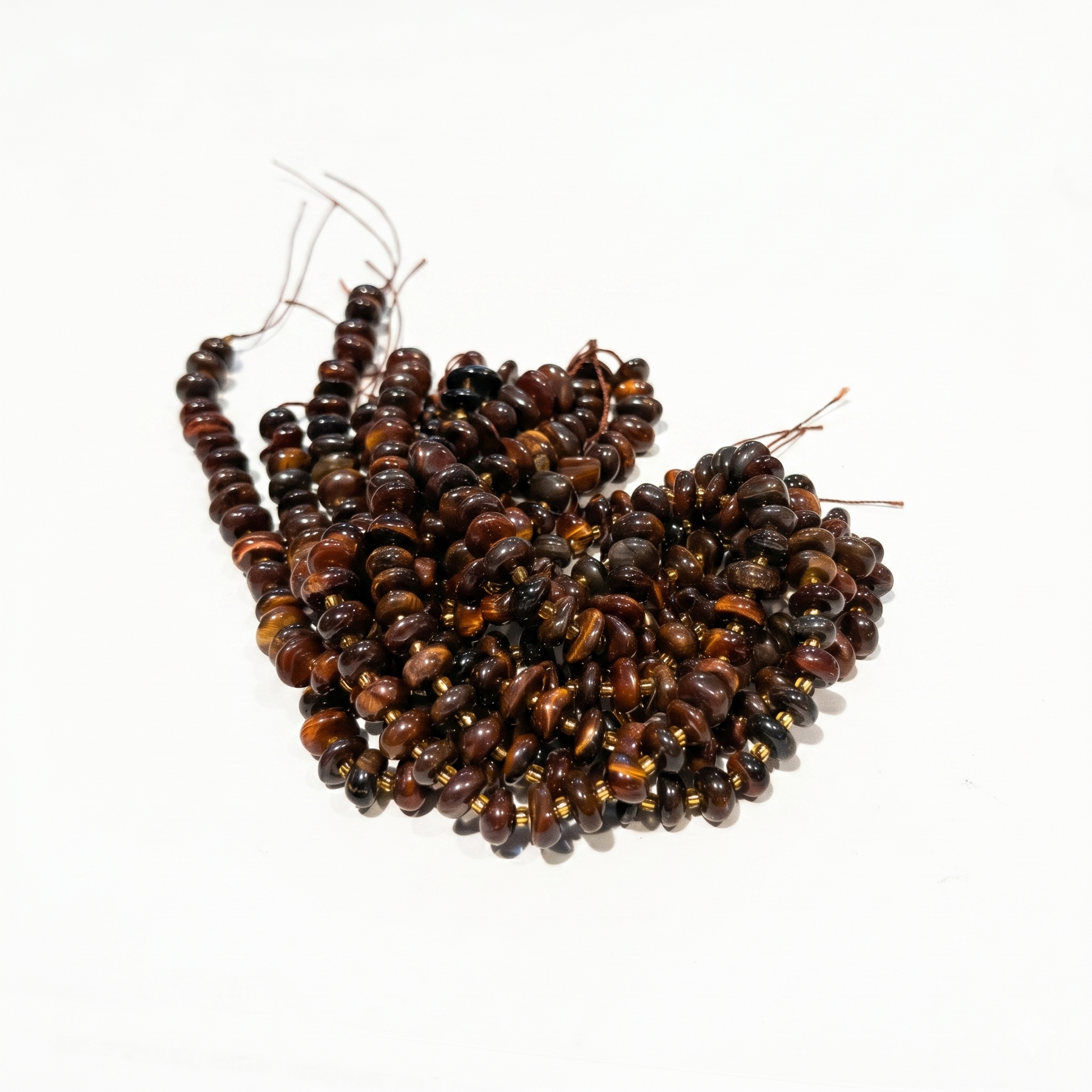 Brown and black beaded strands on a white background