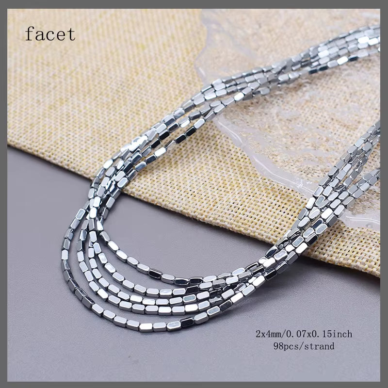 Five strands of silver faceted seed beads arranged in a loop on a gray surface with a beige woven fabric backdrop. Text in the top left reads 'facet', and text in the bottom right specifies '2x4mm/0.