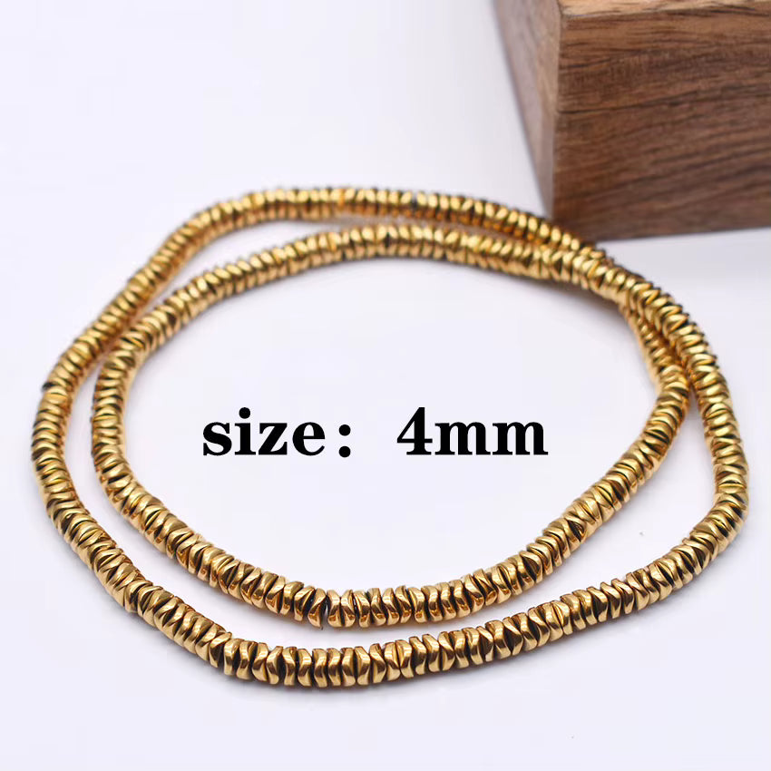 Two coiled strands of small textured gold beads on a white background, with black text reading 'size: 4mm' and a wooden block in the upper right corner.