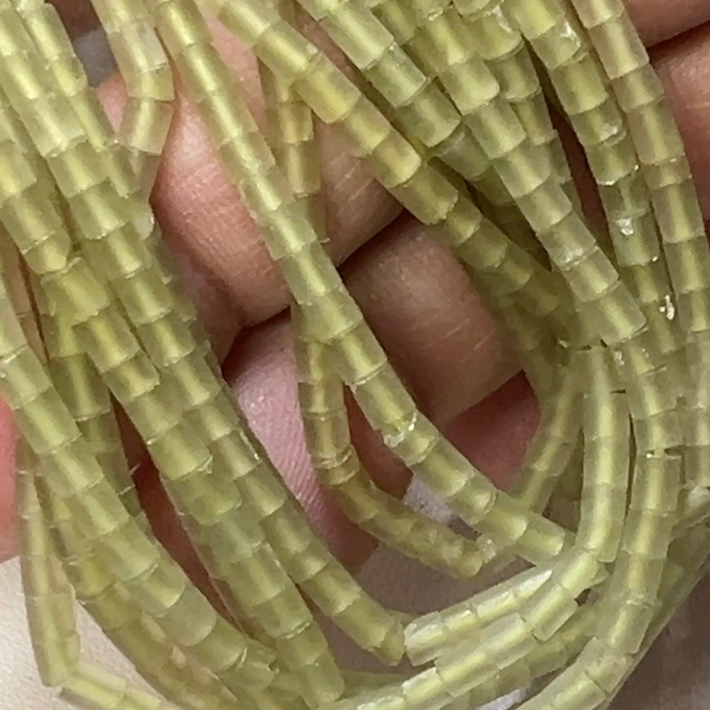 Jade heishi cut beads.  2.5mm 16" strands, no treatments