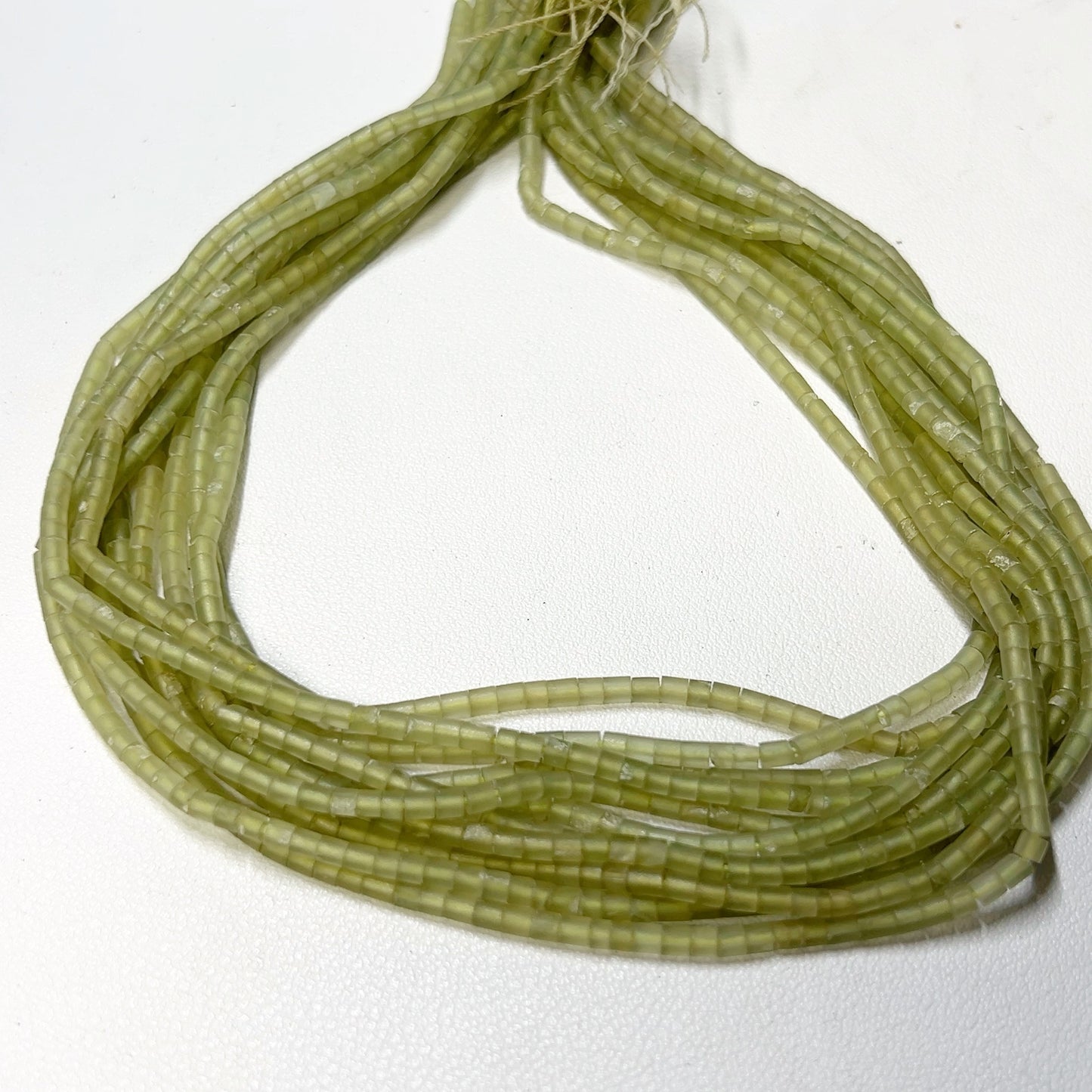 Jade heishi cut beads.  2.5mm 16" strands, no treatments