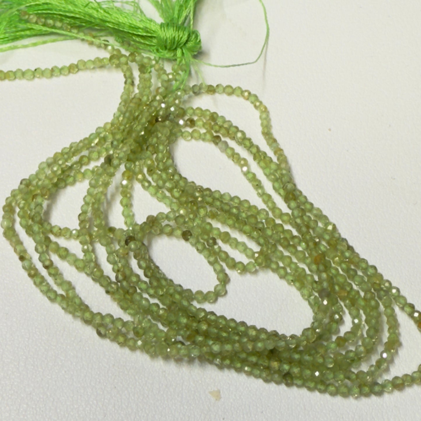 Peridot Faceted Rounds 2 mm 16" Natural