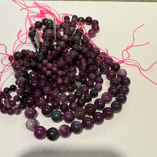 Ruby with some Zoisite.  All natural.  16" strands