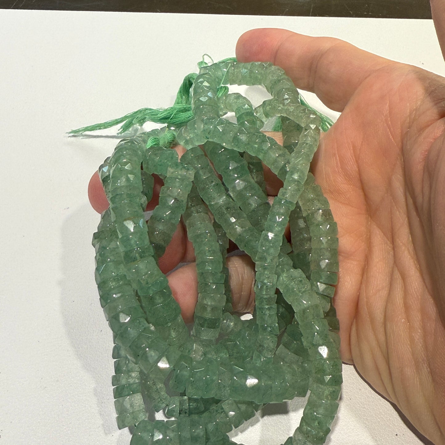 Green Aventurine Natural."Tire Shape" faceted beads 16" long