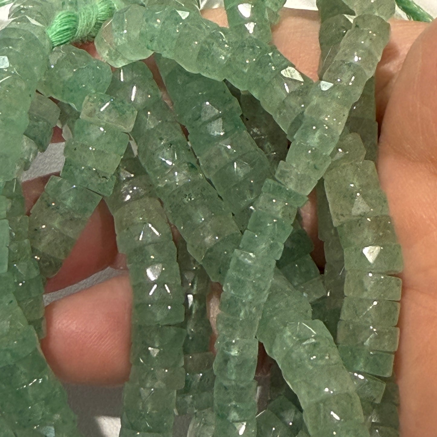 Green Aventurine Natural."Tire Shape" faceted beads 16" long
