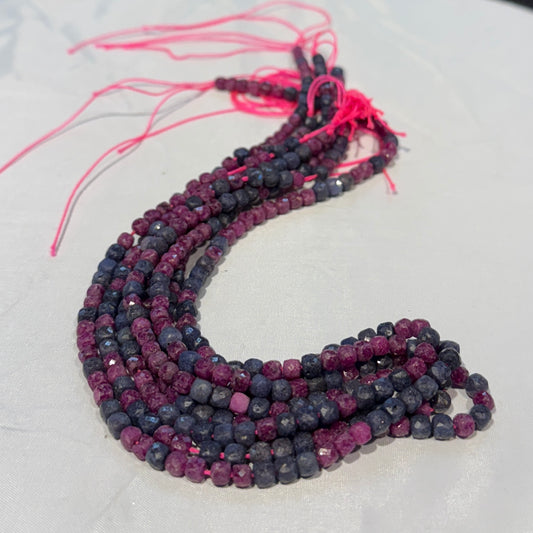 Ruby and Sapphire mix 4mm faceted cubes.  Approx 15" strands