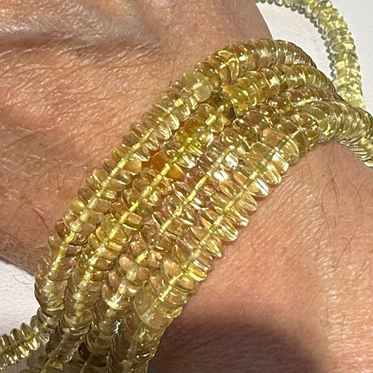 Lemon Citrine 8 mm disc shaped.  Strands are about 10", no treatments