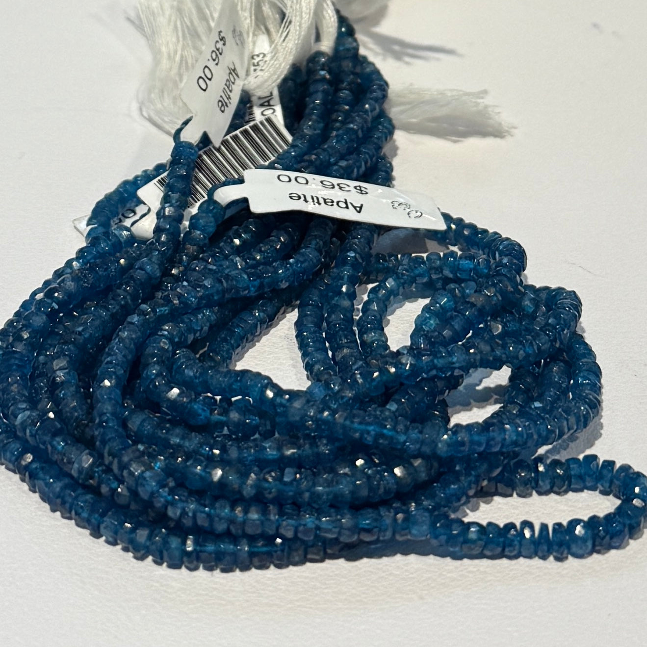 "Neon" Apatite mid blue color.  4 mm faceted roundels approx 15" strands
