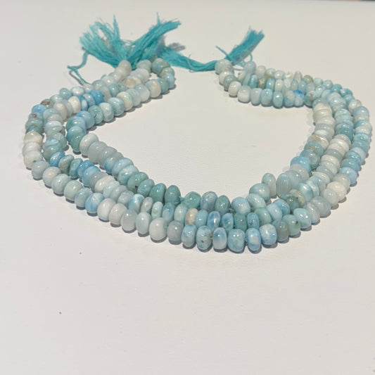 Larimar Roundels Hand cut and polished.  approx 7 mm 15" strands