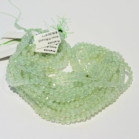 Prehnite 4 mm faceted round beads.  Approx 15" strands