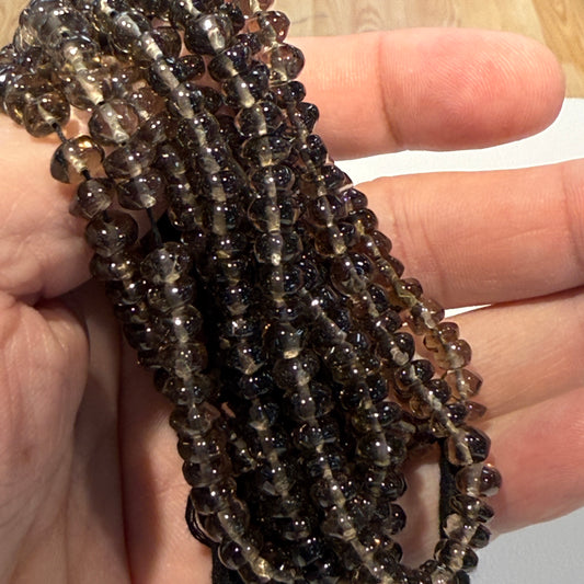 Smokey Quartz roundels smooth.  Approx 6 mm 15" strands, natural