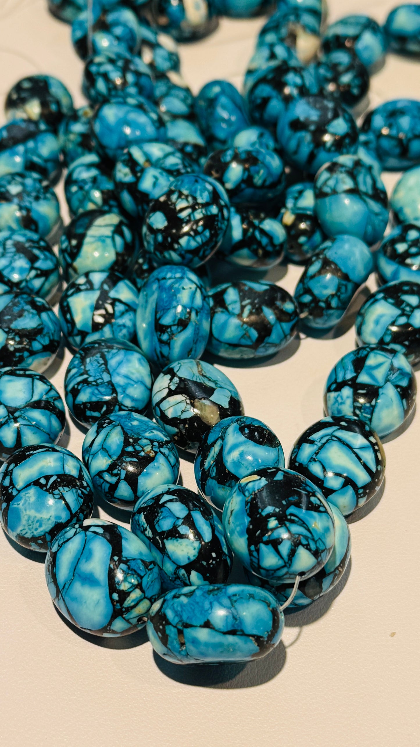 Magnesite, treated to make it look really cool!  20x22mm 15" strands