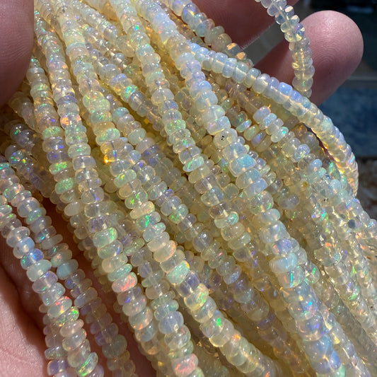 White Base Opal 3-4mm 15" strands. Lots of fire