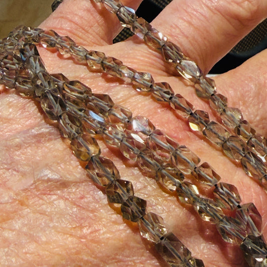 Smokey Quartz beads, faceted, nice quality, approx 15" strands, $10 a strand!