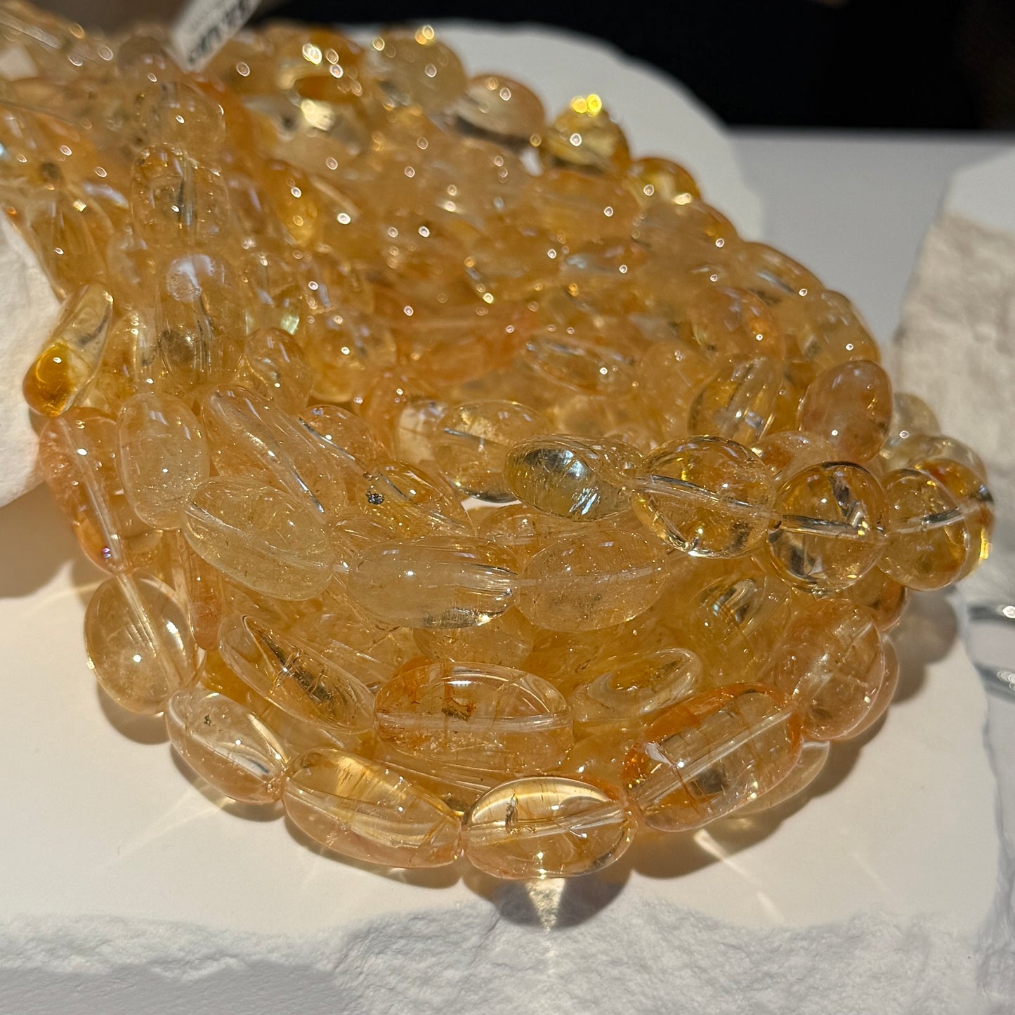 Citrine smooth ovals, irregular shape.  Approx 10x15mm 15" strands