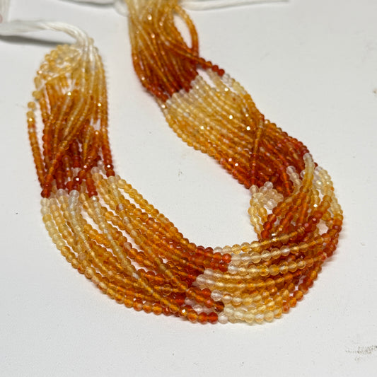 Natural Fire Opal from Mexico.  3mm faceted round beads approx 15" long