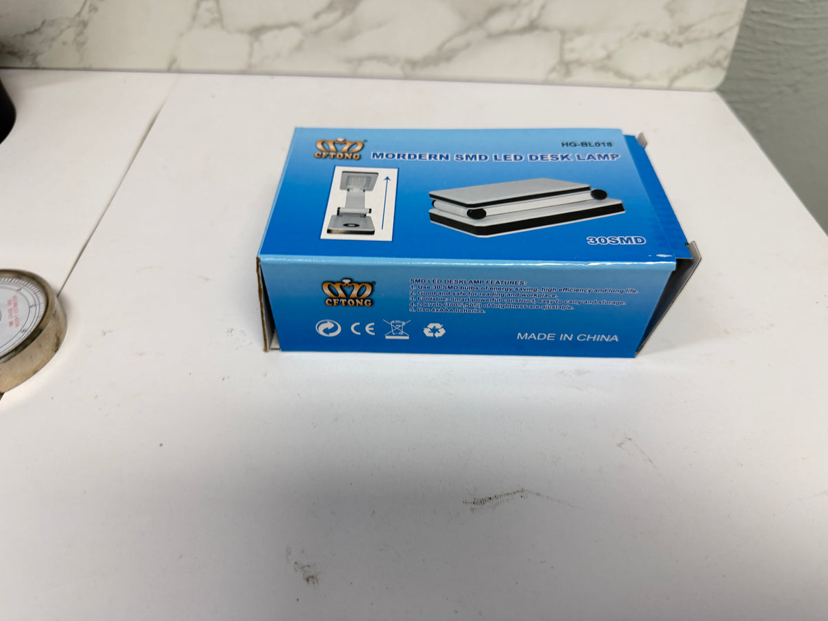Blue retail box for the HG-BL018 portable folding LED desk lamp.