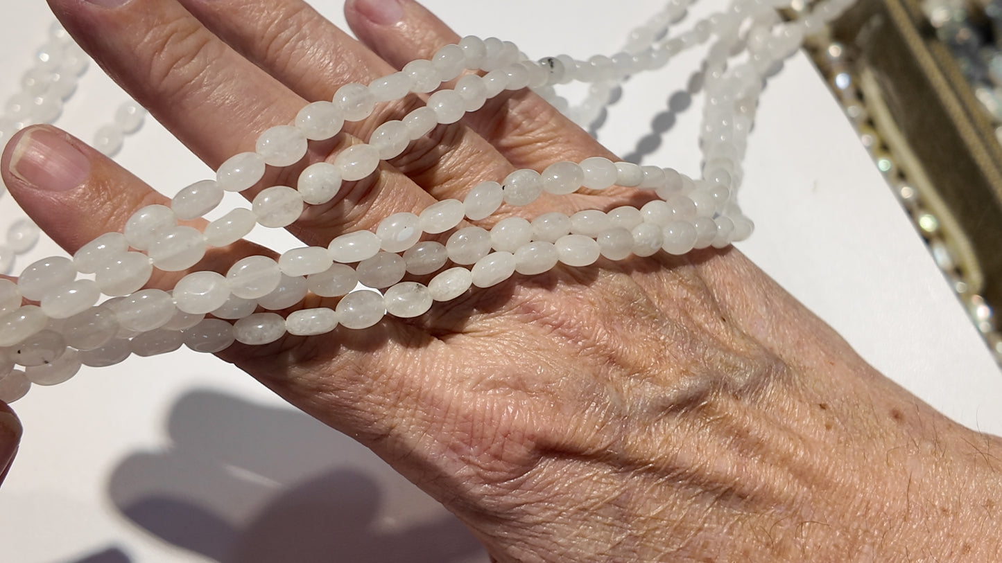 Natural gemstones 6x8mm approx 16" strands flat olive shape.  $10 a strand!