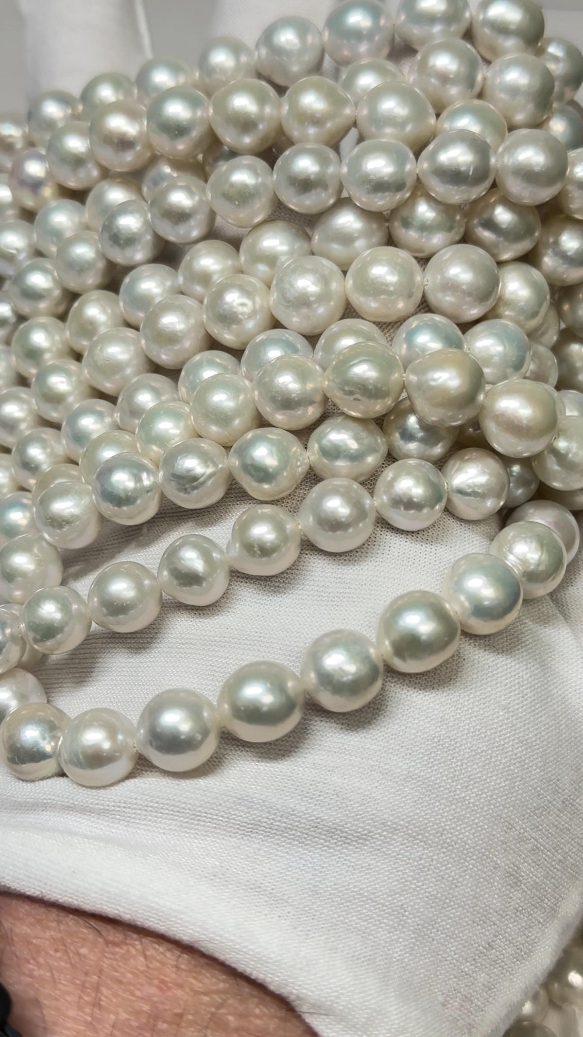 Strands of Pearls on a White Glove