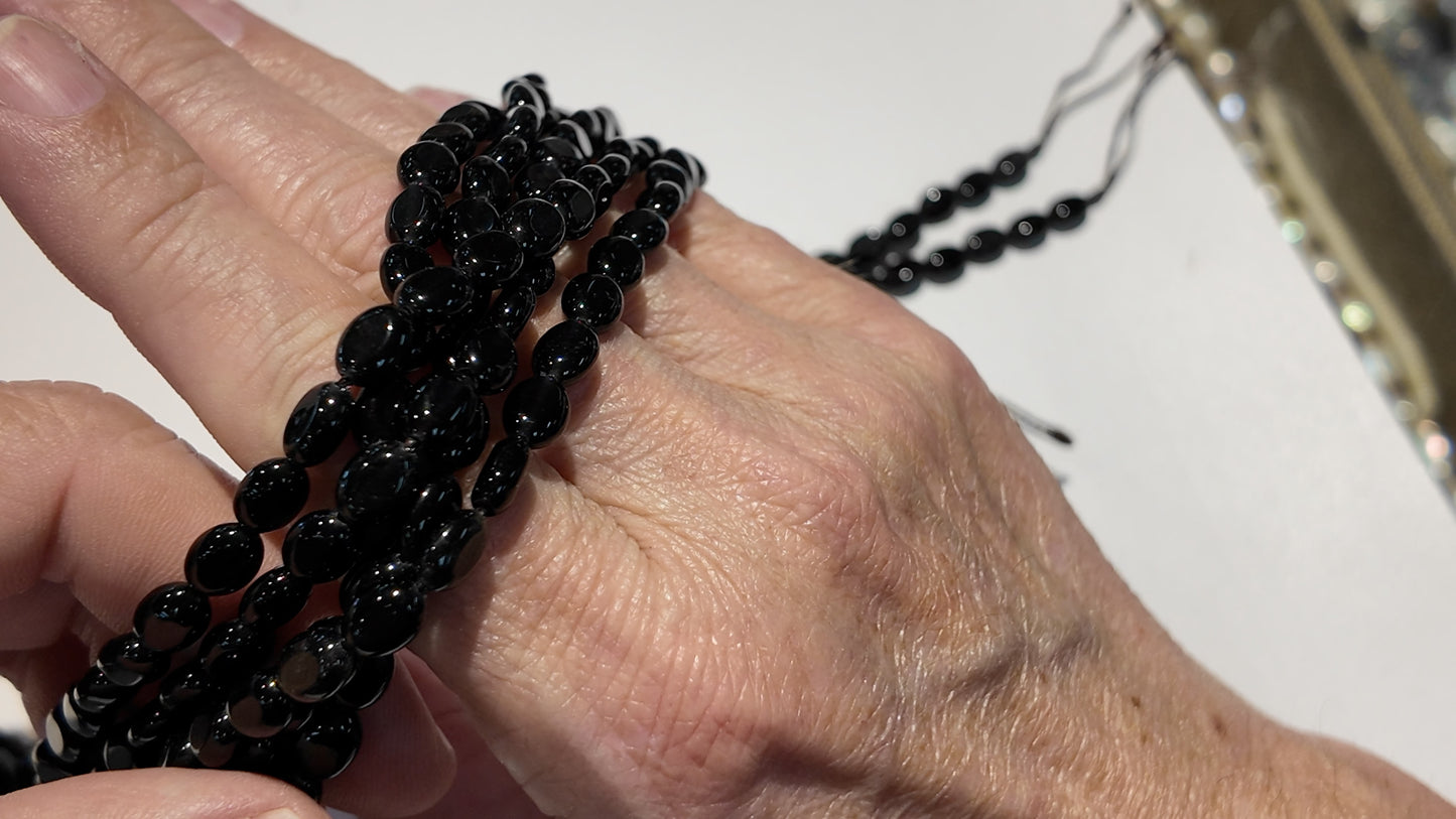 Natural gemstones 6x8mm approx 16" strands flat olive shape.  $10 a strand!
