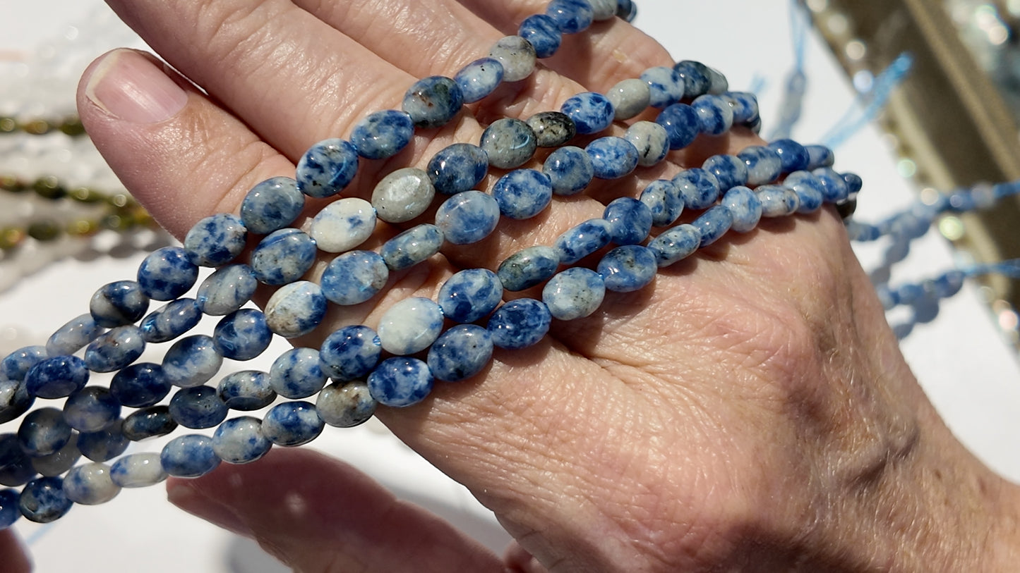 Natural gemstones 6x8mm approx 16" strands flat olive shape.  $10 a strand!